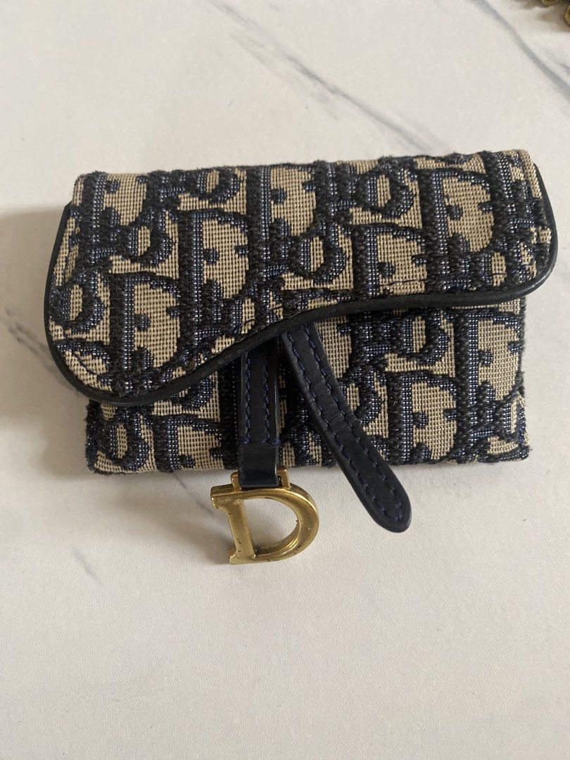 Dior Saddle Wallet with Chain (Category: Luxury Bags & Wallets) located in Manila. Submitted by great_fashion_finds (Listing ID 1452107589, Image 1). Description: - Rare Dior Saddle Wallet - Classic Dior Oblique Canvas - Gold-tone Chain Strap Included - Compact Design for Essentials - Interior 'Christian Dior Paris' Stamping.