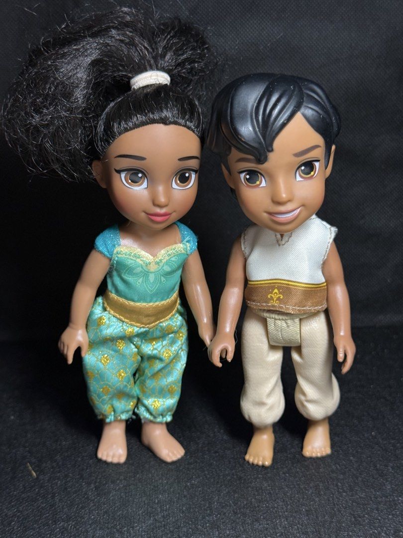 Disney Aladdin & Jasmine Toddler Dolls (Category: Babies & Kids Fashion) located in Quezon. Submitted by onlysunsun (Listing ID 1452308295, Image 1). Description: - Adorable toddler dolls of Aladdin and Jasmine. - Jasmine wears her iconic turquoise outfit with gold accents. - Aladdin is dressed in prince-like attire. - Dolls are holding hands, symbolizing their bond. - Ideal for Disney fans and collectors. - Great for imaginative playtime for tod