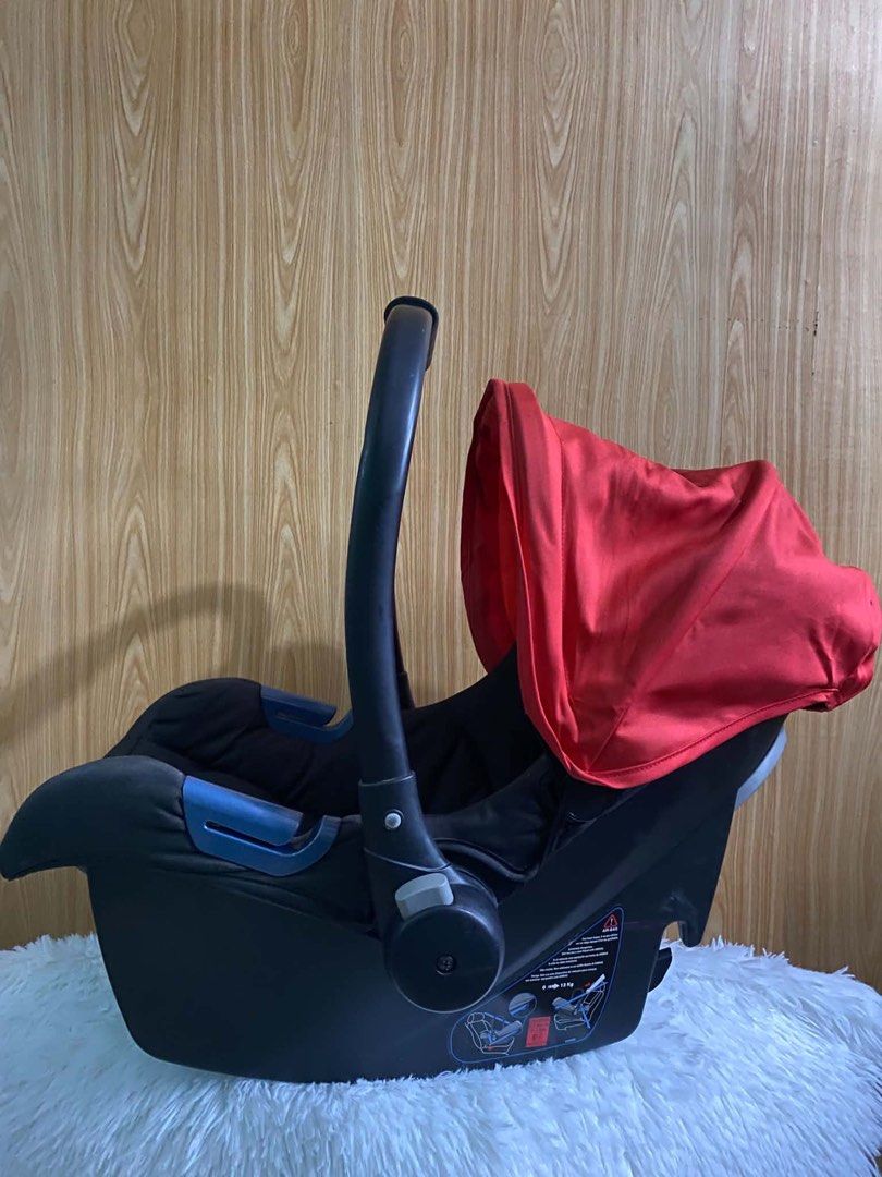 Enfant Baby Car Seat with Base (Category: Car Seats) located in Quezon City. Submitted by shiretsu123 (Listing ID 1452215874, Image 3). Description: - Enfant baby car seat with included base - Red canopy for sun protection - Secure 5-point harness - Convenient easy-carry handle - Ideal for travel and on-the-go.
