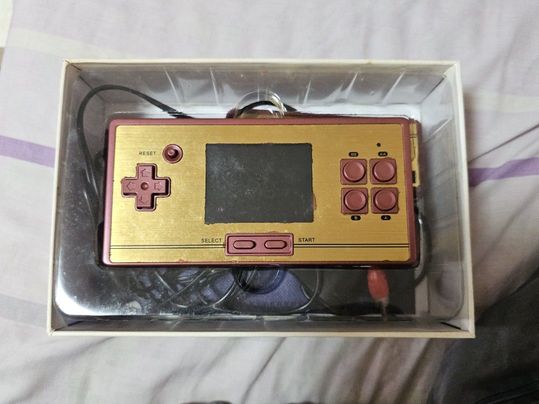 FC Pocket 30th Anniversary Limited Edition Retro Game Console (Category: Others) located in Quezon City. Submitted by buldakprincess (Listing ID 1452151880, Image 2). Description: - fully functional FC Pocket 30th Anniversary Limited Edition - Includes: Console, Controller, Game Card - lumobo na yung battery pack - need palitan ng 3.7V 700mAh Lithium-ion battery pack - All items are in the original box MOD: j&t, lalamove.