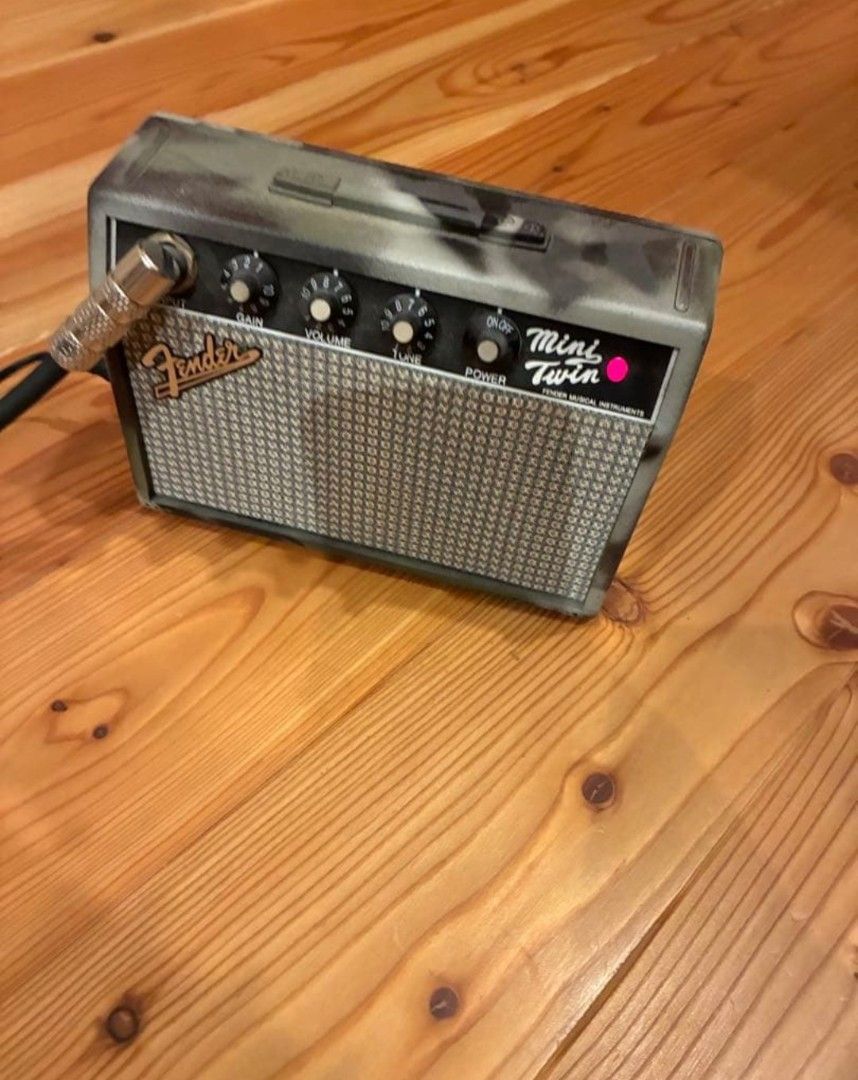 Fender Mini Twin Guitar Amplifier - Camo Edition (Category: Musical Instruments) located in Manila. Submitted by svlsimon (Listing ID 1452114916, Image 1). Description: Limited-edition Fender Mini Twin MT-10 in the hard-to-find Camouflage (Camo) finish. Sourced directly from Japan. Same great 1-watt dual-speaker performance as the standard Mini Twin, but in a discontinued, highly collectible military camo aesthetic. Perfect for desktop setups, tr