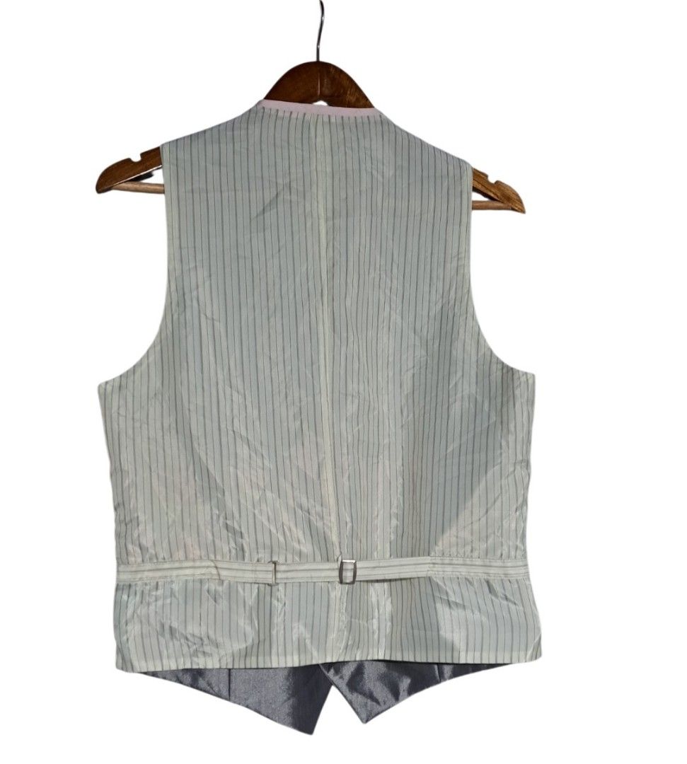 Formal Vest - Silver & Pink Reversible (Category: Vests) located in Batangas. Submitted by yanaspreloved1 (Listing ID 1452222080, Image 3). Description: - Reversible vest: Shiny silver on one side, soft pink on the other. - Classic V-neck design with button closure. - Two functional pockets on the front. - Adjustable strap with buckle at the back for a customized fit. - Versatile for formal events or adding a stylish touch to any outfit..