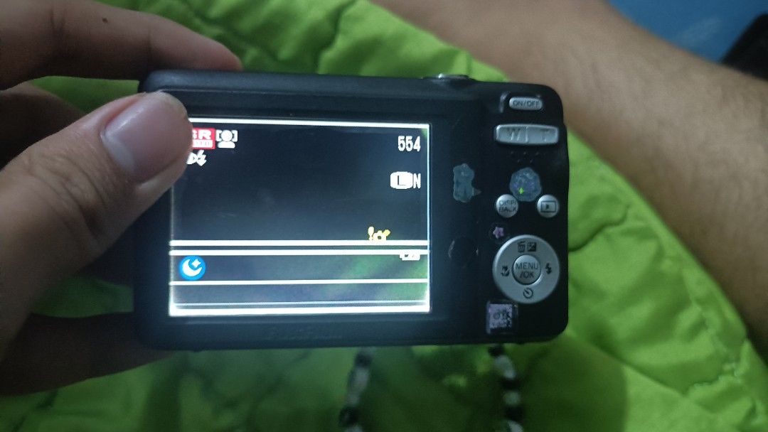 Fujifilm Digital Camera 14 Mega Pixels Purple (Category: Cameras) located in Siay. Submitted by bebengabunoas (Listing ID 1452238807, Image 3). Description: - Fujifilm Digital Camera - Color: Purple - 14 Megapixels - Includes cute beaded strap - Screen has white lines but works perfectly - Ideal for casual photography and preserving memories - Takes good quality pictures - Ready for its new owner! .