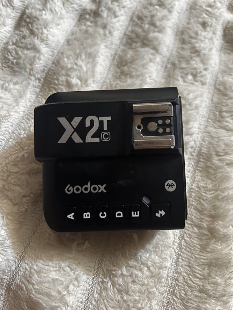 Godox X2T TTL Wireless Flash Trigger Transmitter (Category: Flashes) located in Manila. Submitted by mysticmountain-1762 (Listing ID 1452159203, Image 1). Description: - Godox X2T TTL Wireless Flash Trigger Transmitter - Compatible with Godox flashes - Control multiple groups (A, B, C, D, E) and channels - Clear LCD screen for easy settings adjustment - Hot shoe mount with locking ring for secure attachment - USB-C port for firmware updates.