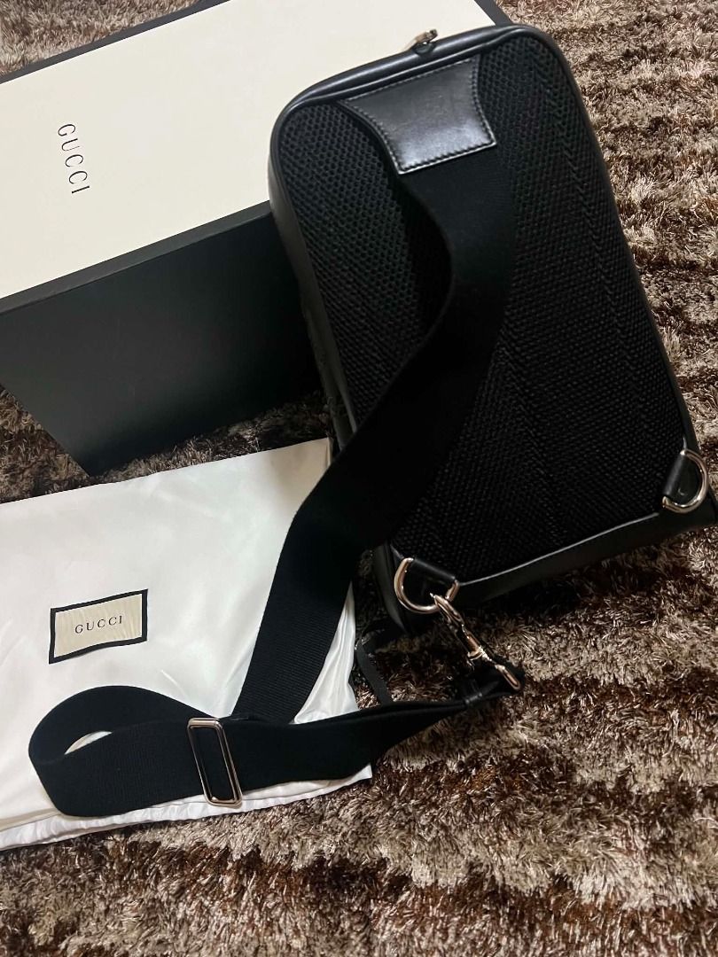 Gucci Black Guccissima Leather One Shoulder Backpack Bag (Category: Luxury Bags & Wallets) located in Manila. Submitted by actd_luxury (Listing ID 1452315460, Image 2). Description: Measurements: 8" L x 3.5" W x 12" H Interior Pockets: Three flat pockets Exterior Pockets: One front zip pocket Handles: Single flat adjustable canvas one shoulder strap Closure/Opening: Two-way zip closure Interior Lining: Fine textile lining Hardware: Silvertone.