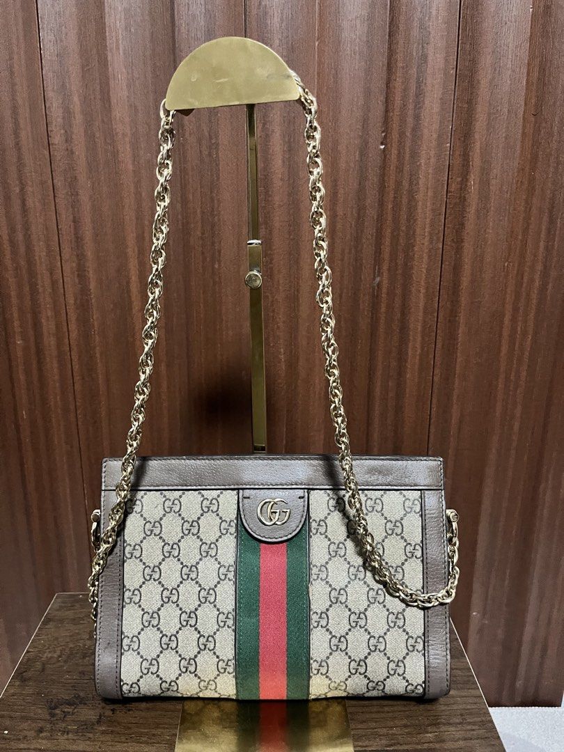 Gucci Ophidia GG Supreme Shoulder Bag (Category: Luxury Bags & Wallets) located in Cebu City. Submitted by nbetcuban007trendyfinds (Listing ID 1452202432, Image 1). Description: - Authentic Gucci Ophidia shoulder bag - Classic GG Supreme canvas - Signature green and red stripe detail - Gold-tone chain strap - Versatile for day or night use - Last pic sample only (price value at the other shops).