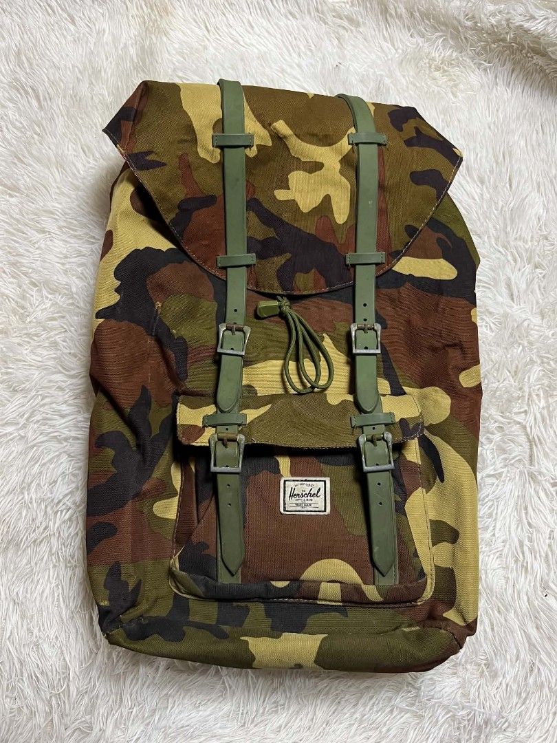 Herschel Supply Co. Camo Backpack (Category: Backpacks) located in Manila. Submitted by senggggg. (Listing ID 1452248286, Image 1). Description: good condition working zip minimal scratch check details and size.