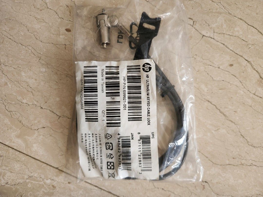Computer Cable Lock (Category: Cables & Adaptors) located in Singapore. Submitted by moving_2026 (Listing ID 1452208478, Image 1). Description: - HP Ultraslim Keyed Cable Lock - Part Number: 699921-001 - Includes keys - Ideal for securing laptops and other devices - Still in original packaging - Made in Taiwan.