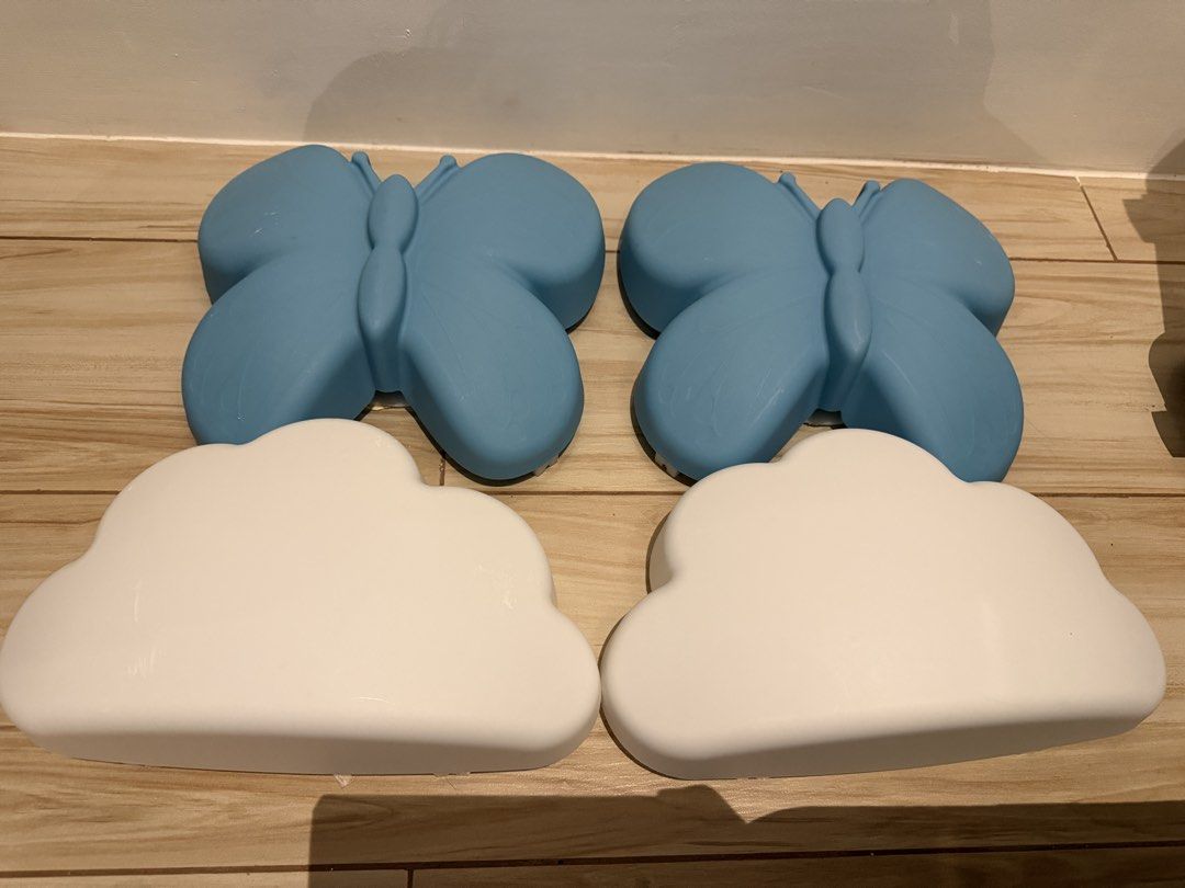 IKEA UPPLYST Cloud & Butterfly LED Wall Lamps (Category: Lighting) located in Orani. Submitted by wearandtwirl (Listing ID 1452240950, Image 1). Description: - Set of IKEA UPPLYS T cloud and blue butterfly wall lamps - Energy-efficient LED lights - Includes power adapter - Ideal for children's rooms or nurseries - Creates a whimsical and magical atmosphere - Provides a pleasant, soft illumination.