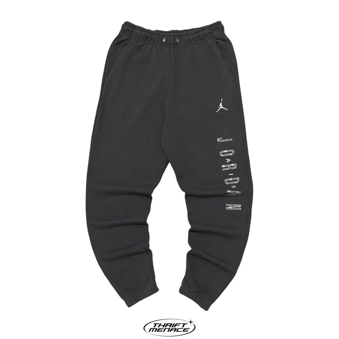 Jordan Sweatpants Black (Category: Joggers) located in Manila. Submitted by urboycee (Listing ID 1452110601, Image 2). Description: - Authentic Jordan sweatpants - Features iconic Jumpman logo and 'JORDAN' text graphic - Comfortable elastic waistband with adjustable drawstring - Ribbed cuffs for a snug fit - Made from 100% soft cotton - Ideal for everyday casual wear or athletic training.