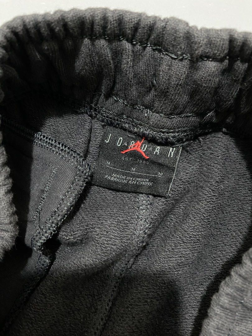Jordan Sweatpants Black (Category: Joggers) located in Manila. Submitted by urboycee (Listing ID 1452110601, Image 3). Description: - Authentic Jordan sweatpants - Features iconic Jumpman logo and 'JORDAN' text graphic - Comfortable elastic waistband with adjustable drawstring - Ribbed cuffs for a snug fit - Made from 100% soft cotton - Ideal for everyday casual wear or athletic training.