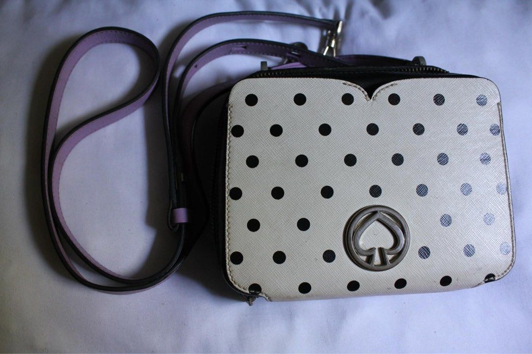 Kate Spade Polka Dot Handbag (Category: Luxury Bags & Wallets) located in Dagupan City. Submitted by nikoal (Listing ID 1452200896, Image 2). Description: Authentic Kate Spade handbag. CONDITION OF THE BAG: - visible rubbing and peeling on the bottom corners of the front panel, not that noticeable tho. - may slight discoloration. The fabric lining inside shows yellow-ish staining. - Noticeable minor scratches sa metal parts ng bag .