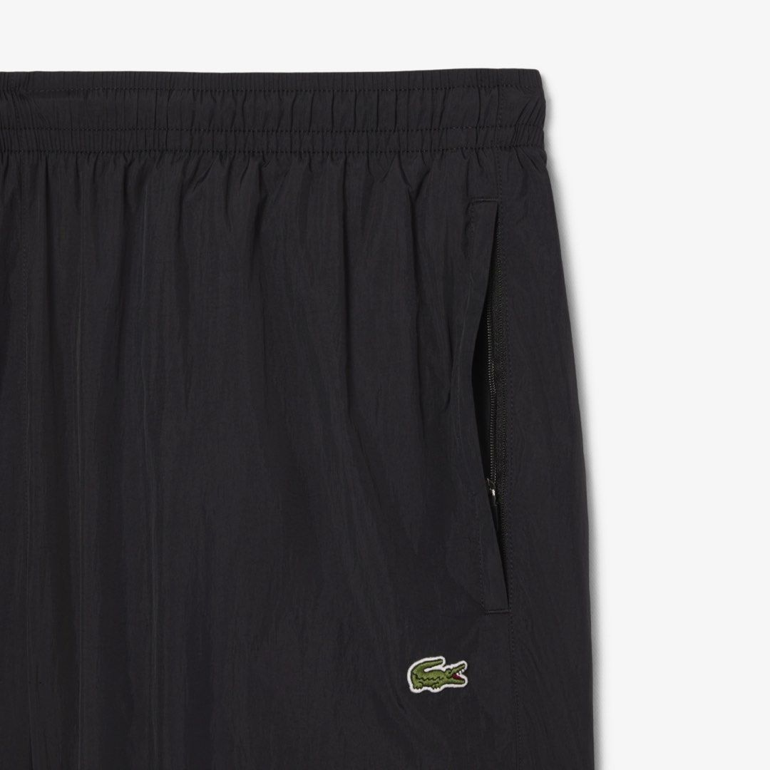 Lacoste Lightweight Water-Repellant Sweatpants (Category: Activewear) located in Quezon City. Submitted by labnstyle (Listing ID 1452278198, Image 2). Description: Bought in Korea 7950 in PH store Color: Navy blue Size: FR 3 Small. Can fit small to semi-large. Unisex Actual pics for sure buyer only. Price still slightly neg. Description: Made from taffeta for a lightweight, breathable finish, with water-repellent coating to keep you dry. A timele
