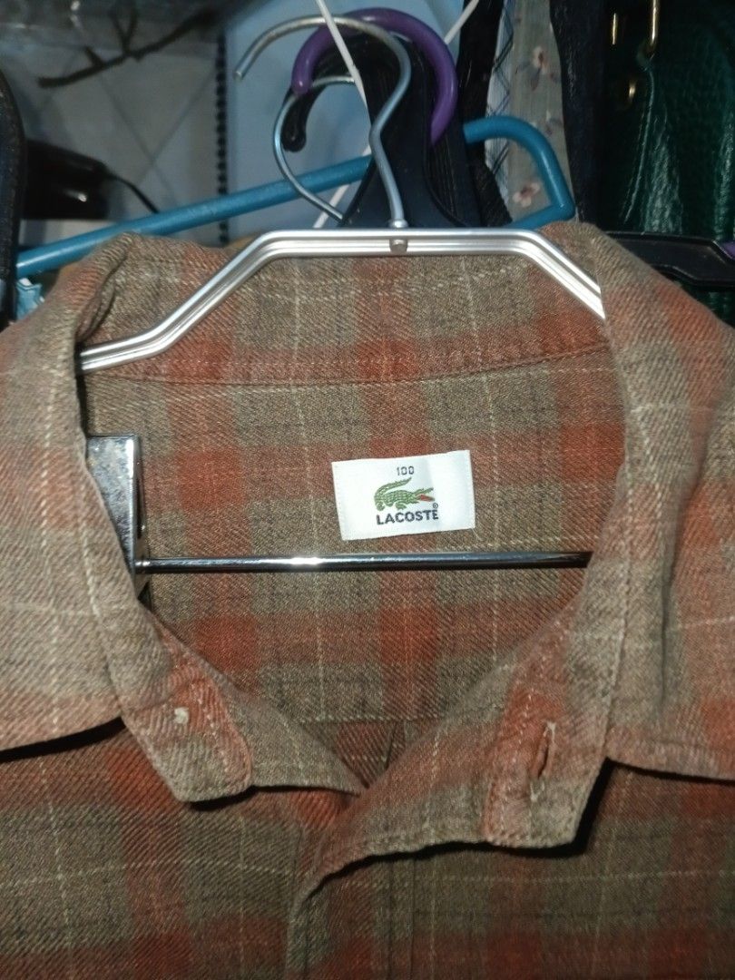 Lacoste Plaid Long Sleeve Shirt (Category: Tshirts & Polo Shirts ) located in Valenzuela. Submitted by relchris22 (Listing ID 1452271137, Image 2). Description: - Classic Lacoste plaid design - Long sleeves with button cuffs - Two chest pockets with button closures - Button-up front - Comfortable and stylish for everyday wear - Ideal for layering.
