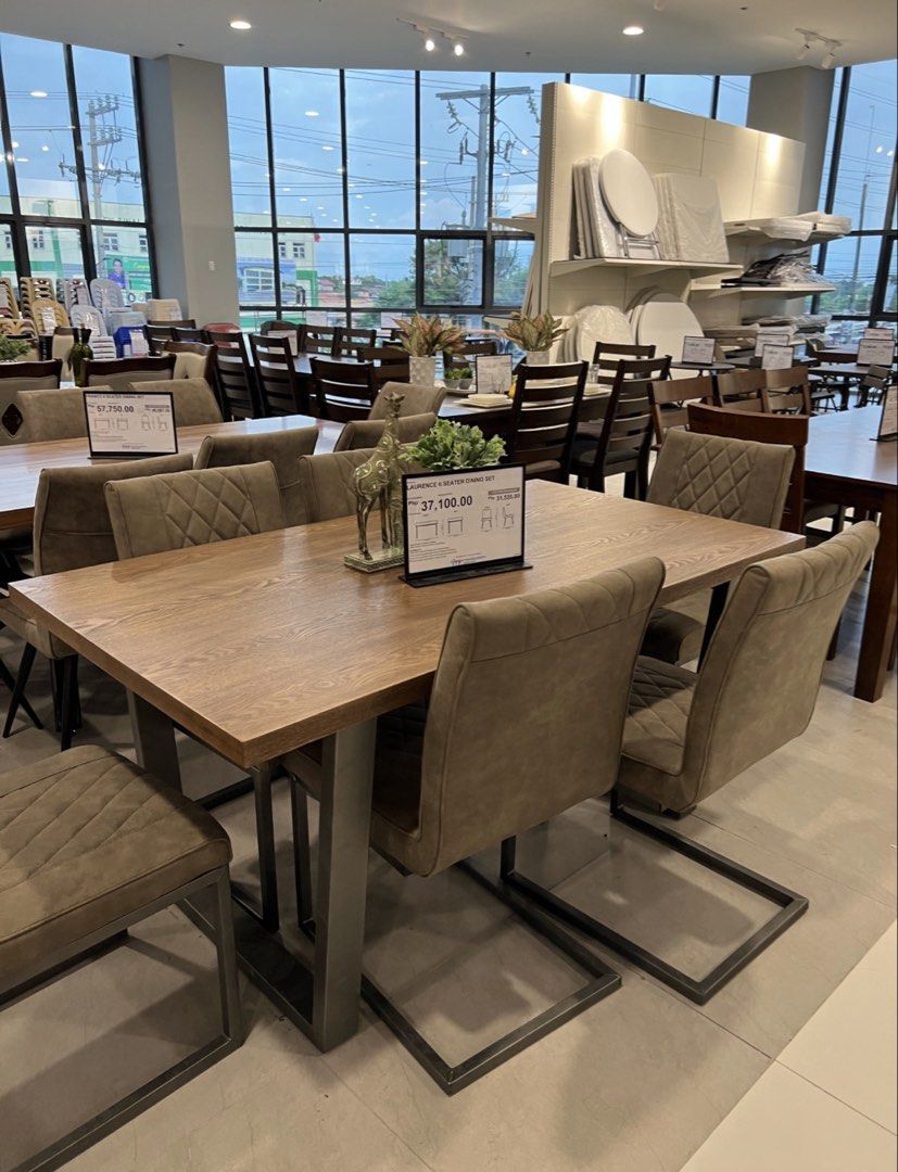 Laurence 6 Seater Dining Set (Category: Tables & Sets) located in Caloocan City. Submitted by lucky.hera_ (Listing ID 1452131661, Image 3). Description: - Laurence 6-seater dining set - Solid wood table top with sturdy metal legs - Upholstered chairs featuring elegant diamond stitch pattern - Comfortably seats 6 people - Perfect for family gatherings and entertaining guests - Original Retail Price: P37,100.00 -Selling for only 18,000 -RFS: Need t