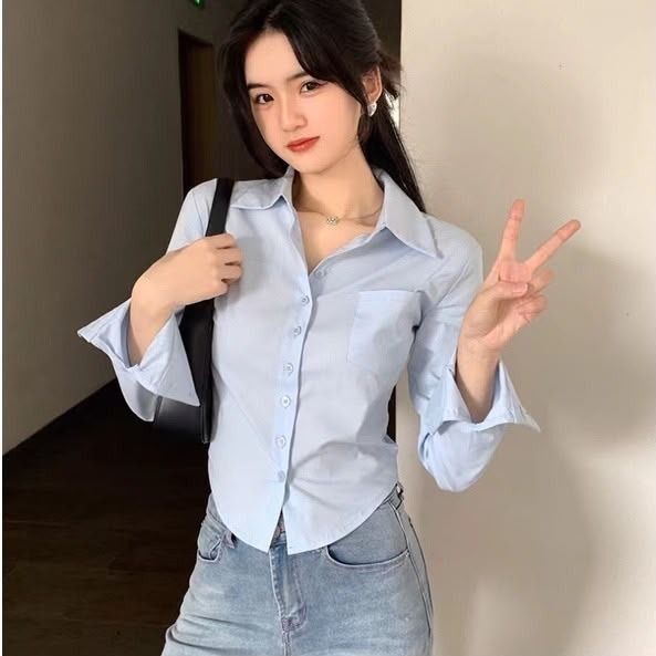 Light Blue Cropped Button-Up Shirt (Category: Longsleeves) located in Georgetown. Submitted by vonneeeeee (Listing ID 1452192362, Image 1). Description: - Shoulder 31.5cm - Sleeve 57cm - Length 42 - 48cm - Slight stains on sleeve parts - Condition 7/10 *PURCHASE RM25 & ABOVE FREE SHIPPING‼️ ‼️.