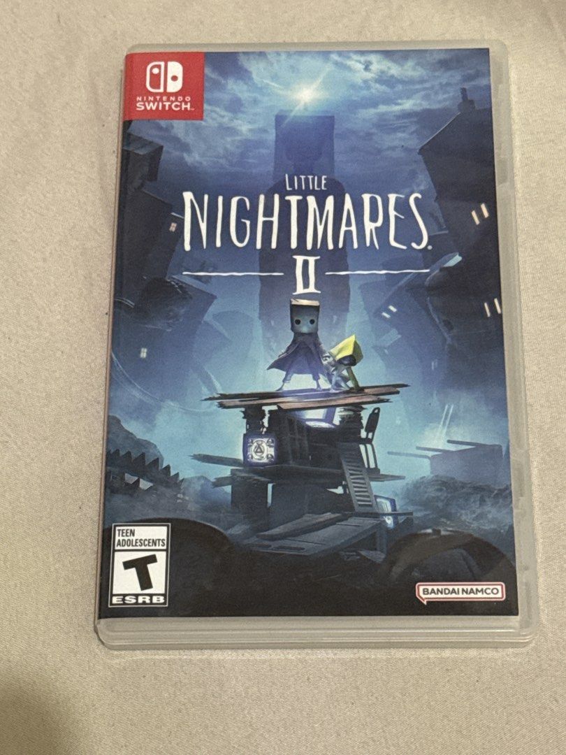Little Nightmares II Nintendo Switch Game (Category: Nintendo) located in Manila. Submitted by noir.market.2018_555 (Listing ID 1452293644, Image 1). Description: - Little Nightmares II for Nintendo Switch - Physical game cartridge - ESRB Rating: Teen - Publisher: Bandai Namco - Genre: Puzzle-platformer horror.