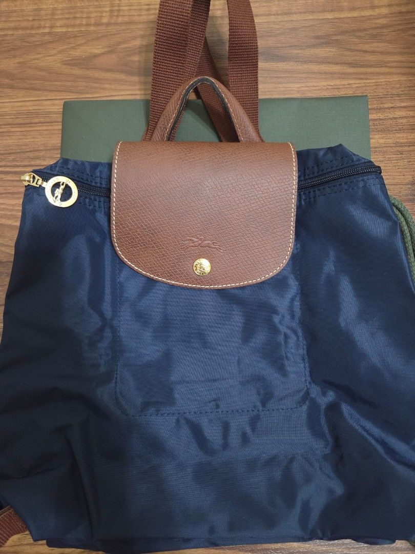 Longchamp Le Pliage Backpack Navy Blue (Category: Luxury Bags & Wallets) located in Cainta. Submitted by tiny_mom (Listing ID 1452247291, Image 3). Description: - Navy blue Longchamp backpack - Genuine leather trim and handles - Elegant gold hardware details - Comes with original dust bag - Includes original receipt from Nordstrom - Ideal for everyday use or travel.