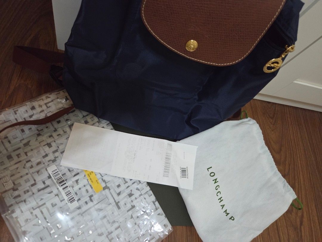 Longchamp Le Pliage Backpack Navy Blue (Category: Luxury Bags & Wallets) located in Cainta. Submitted by tiny_mom (Listing ID 1452247291, Image 1). Description: - Navy blue Longchamp backpack - Genuine leather trim and handles - Elegant gold hardware details - Comes with original dust bag - Includes original receipt from Nordstrom - Ideal for everyday use or travel.