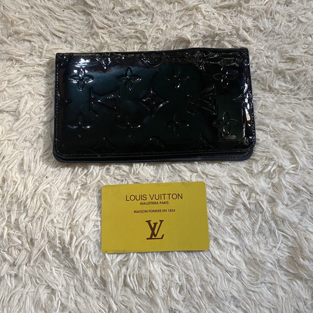 Louis Vuitton Monogram Vernis Wallet (Category: Luxury Bags & Wallets) located in Cebu City. Submitted by stevenkylegil (Listing ID 1452166611, Image 1). Description: - Authentic Louis Vuitton wallet - Black Monogram Vernis leather - Multiple card slots for organization - Comes with authenticity card - Classic and essential accessory.