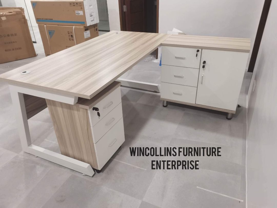 L-Shape executive table with pedestal cabinet / Boss Table (Category: Tables & Sets) located in Quezon City. Submitted by wincocami_ (Listing ID 1452120993, Image 1). Description: L-shape executive table / boss table 25mm melamine finish With movable side table with built in cabinet Movable mobile pedestal with lock Metal legs Item Dimension: Front Table: L160cm x W80cm x H76cm Side Table: L120cm x W40cm x H76cm Item Dimension: Front Table: L140c