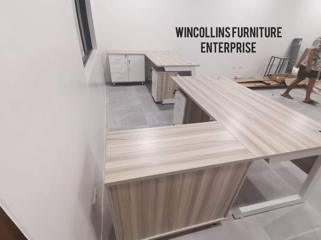 L-Shape executive table with pedestal cabinet / Boss Table (Category: Tables & Sets) located in Quezon City. Submitted by wincocami_ (Listing ID 1452120993, Image 2). Description: L-shape executive table / boss table 25mm melamine finish With movable side table with built in cabinet Movable mobile pedestal with lock Metal legs Item Dimension: Front Table: L160cm x W80cm x H76cm Side Table: L120cm x W40cm x H76cm Item Dimension: Front Table: L140c