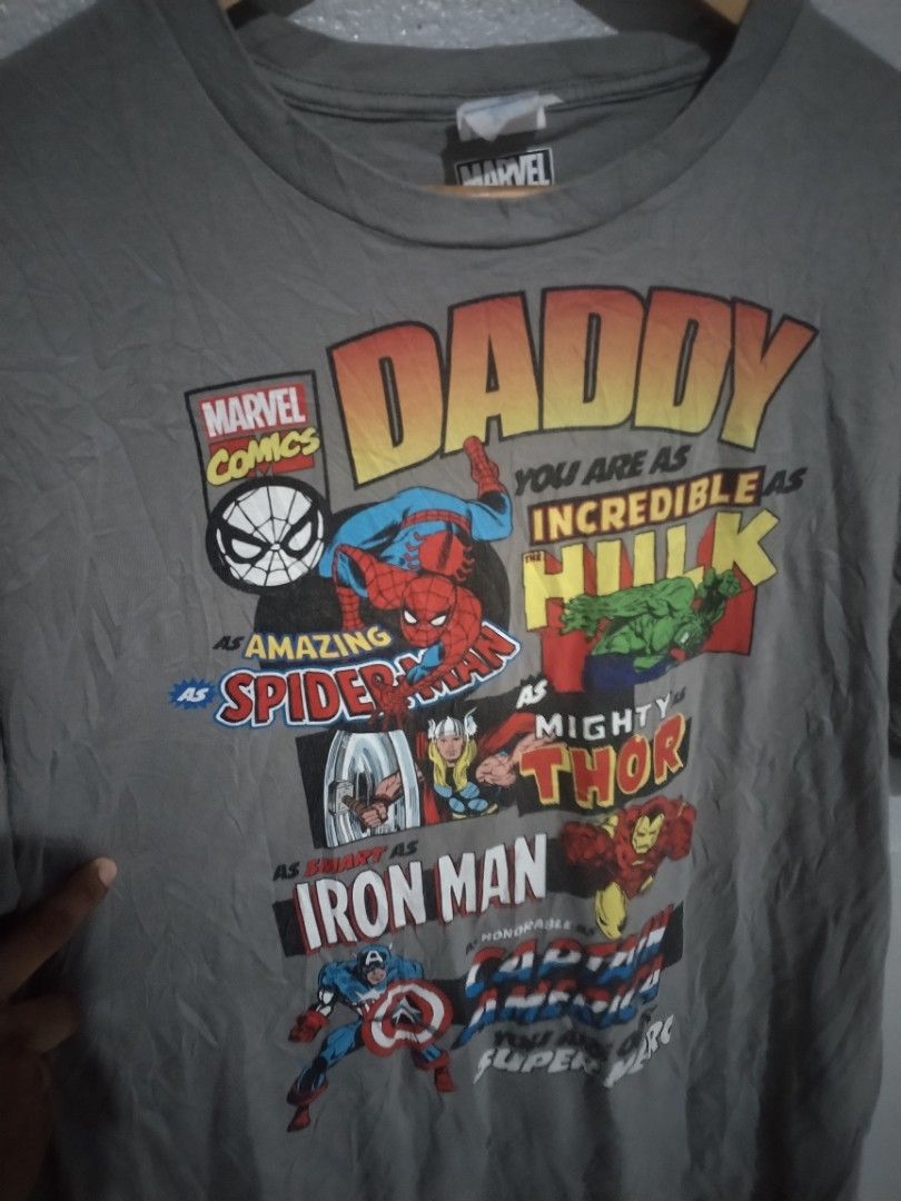 Marvel Comics Daddy Graphic T-Shirt XL (Category: Tshirts & Polo Shirts ) located in Naga. Submitted by basejohnpa64527 (Listing ID 1452125464, Image 3). Description: - Grey Marvel Comics T-Shirt for Daddy - Features Spiderman, Hulk, Iron Man, Thor, and Captain America - "Daddy you are as incredible as Hulk, as amazing as Spiderman, as mighty as Thor, as strong as Iron Man, and our super hero" graphic - Size: XL -Very Good Cond - Ideal gift for d