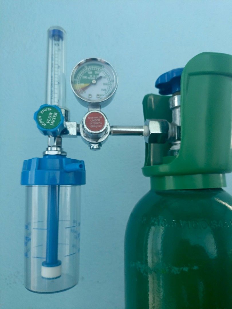 Medical Oxygen Cylinder with Flow Meter and Regulator (Category: Medical Supplies & Tools) located in General Trias. Submitted by sssean143 (Listing ID 1452197752, Image 2). Description: - Green medical oxygen cylinder - Includes flow meter and regulator for controlled oxygen delivery - Flow meter with clear adjustment markings - Attached pressure gauge - Need to refill - Please check photos for details.
