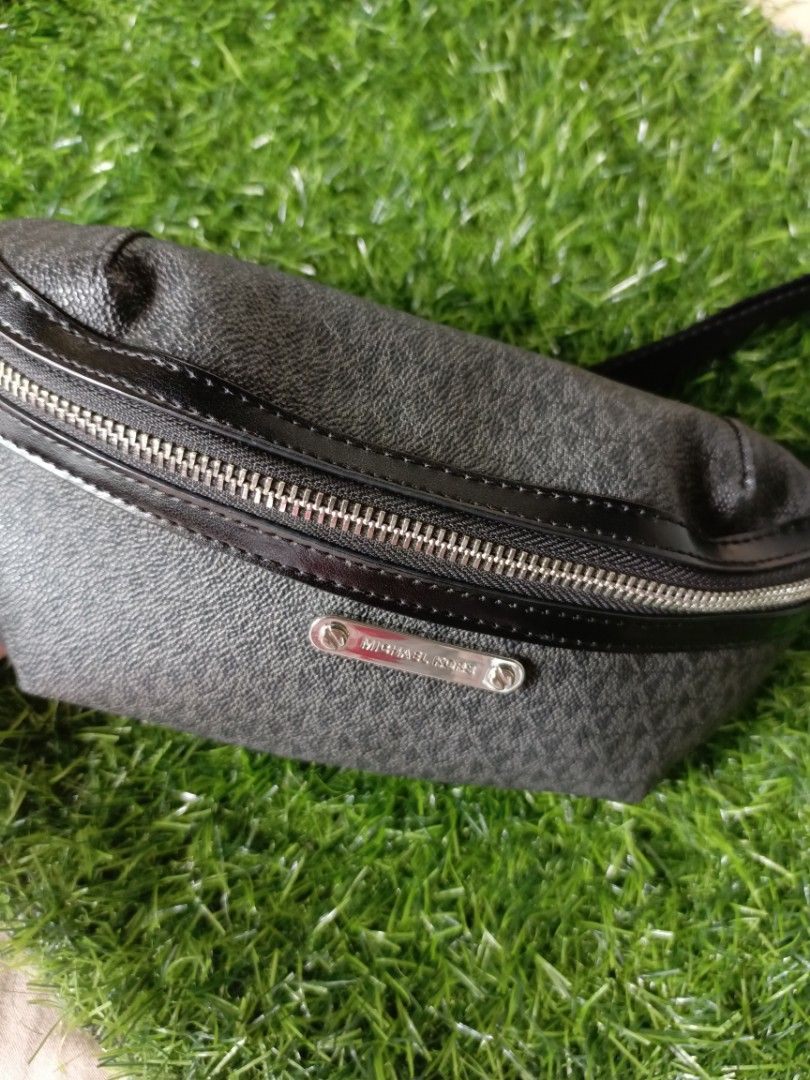 Michael Kors Monogram Fanny Pack Belt Bag (Category: Luxury Bags & Wallets) located in Subic. Submitted by addiestrend (Listing ID 1452161715, Image 2). Description: - Authentic Michael Kors fanny pack - Classic black with signature MK monogram pattern - Secure zip closure for the main compartment - Adjustable strap with buckle for a comfortable fit - Ideal for keeping essentials handy during travel or everyday outings - bought in Ross no tags ve