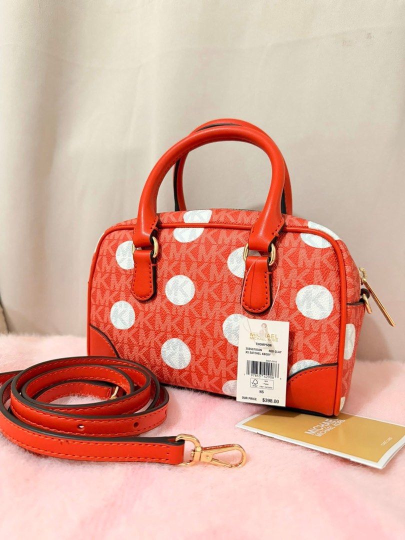Michael Kors Polka Dot Satchel Bag (Category: Luxury Bags & Wallets) located in Angeles City. Submitted by kimkim_06_614 (Listing ID 1452262913, Image 2). Description: - Authentic Orange Michael Kors Satchel Bag - Features a chic white polka dot pattern - All-over MK logo print for signature style - Elegant gold hardware details - Includes a convenient detachable crossbody strap - Comes with original care card - Versatile for everyday use or even