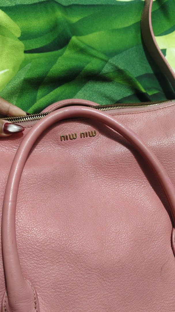Miu Miu Pink Leather Shoulder Bag (Category: Luxury Bags & Wallets) located in Tambulig. Submitted by cmscloset_ph (Listing ID 1452132009, Image 1). Description: - Genuine pink Miu Miu leather bag - Versatile: Top handles and detachable shoulder strap - Elegant gold hardware details - Secure zipper closure - MADE in TURKEY ON BLACK TAG 🖤 - Ideal for everyday style and practicality.