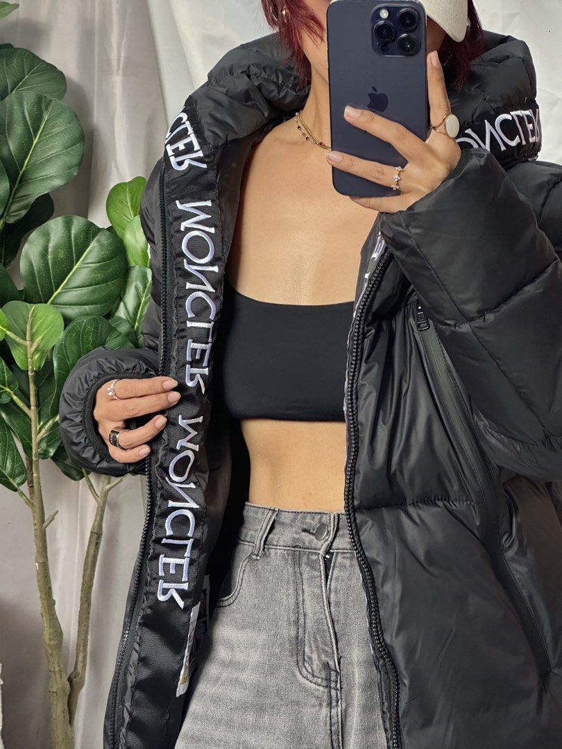 Moncler Black Puffer Jacket with Logo Detail (Category: Coats, Jackets and Outerwear) located in Valenzuela. Submitted by watnbtem_16 (Listing ID 1452305464, Image 2). Description: - Authentic Moncler black puffer jacket - Features iconic Moncler logo on hood lining and sleeve patch - Zip-up front closure for easy wear - Convenient pockets for essentials - Warm and stylish design, ideal for colder weather - A must-have designer piece for your war