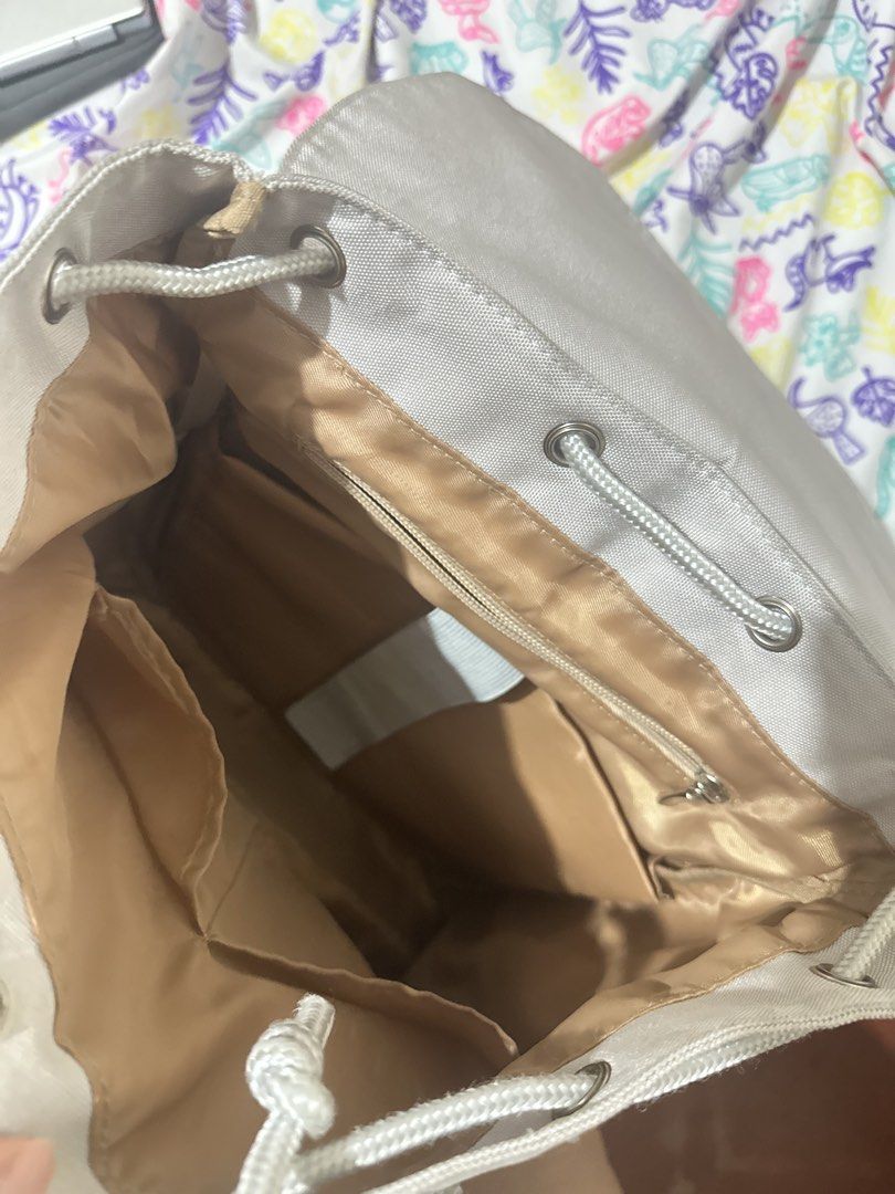 Murioki Light Grey Canvas Backpack (Category: Backpacks) located in Taytay. Submitted by declutter_random (Listing ID 1452122499, Image 3). Description: Light grey murioki canvas backpack. Flap top with buckles and drawstring inside. Back zip pocket, interior zip and slip pockets, side pockets. Perfect for daily use or travel..