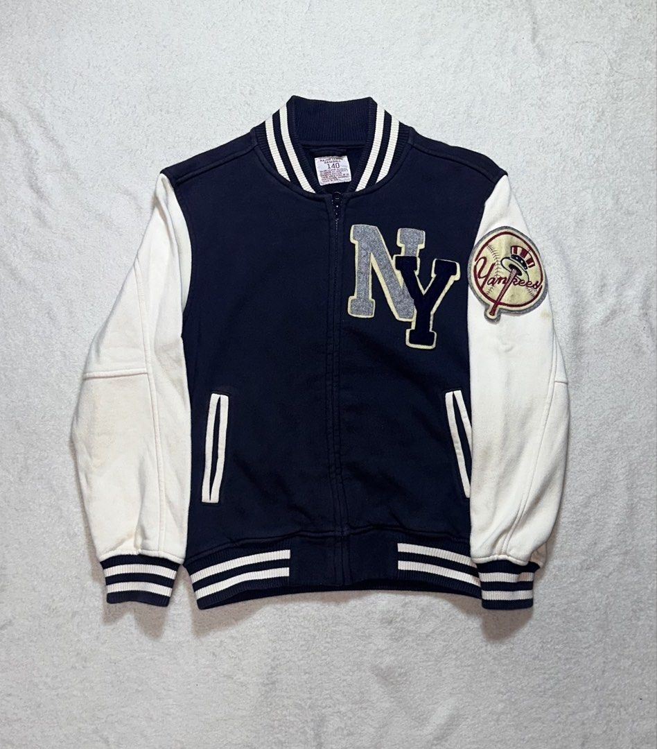 New York Yankees Varsity Jacket Navy Blue White (Category: Coats, Jackets and Outerwear) located in Quezon City. Submitted by mclnd_aj (Listing ID 1452236913, Image 1). Description: - Classic New York Yankees varsity jacket - Navy blue body with white sleeves - Iconic NY logo on the front - "New York Yankees" text on the back - Ribbed cuffs and hem for a snug fit - Full zipper closure - Perfect for any baseball fan! for kids.