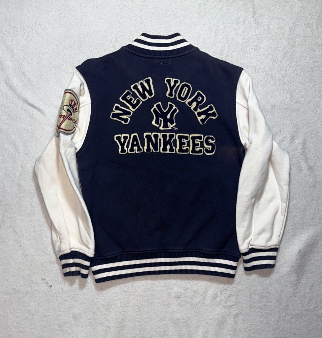 New York Yankees Varsity Jacket Navy Blue White (Category: Coats, Jackets and Outerwear) located in Quezon City. Submitted by mclnd_aj (Listing ID 1452236913, Image 3). Description: - Classic New York Yankees varsity jacket - Navy blue body with white sleeves - Iconic NY logo on the front - "New York Yankees" text on the back - Ribbed cuffs and hem for a snug fit - Full zipper closure - Perfect for any baseball fan! for kids.