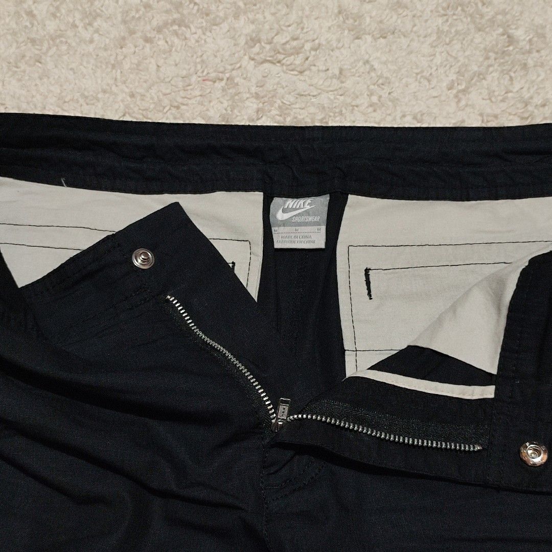 Nike Cargo Shorts Black Zip Pockets Drawstring Waist (Category: Shorts) located in Manila. Submitted by anthonig (Listing ID 1452263463, Image 3). Description: Color is solid black Length: 22 inches Width: 31 inches Hem: 10 inches Price: 600 pesos Condition: 9.8/10 Issues: none PM if interested or for inquiries Meetups within MANILA only Can do shipping at buyers expense .