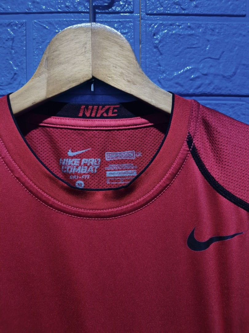 Nike Pro Combat Dri-Fit Red Compression T-Shirt Size M (Category: Activewear) located in Davao. Submitted by vndrgd (Listing ID 1452244522, Image 3). Description: - Red Nike Pro Combat Dri-Fit T-shirt - Compression Fit - Size: Medium (M) - Measurements: 16" width, 25" length - Ideal for workouts and sports.