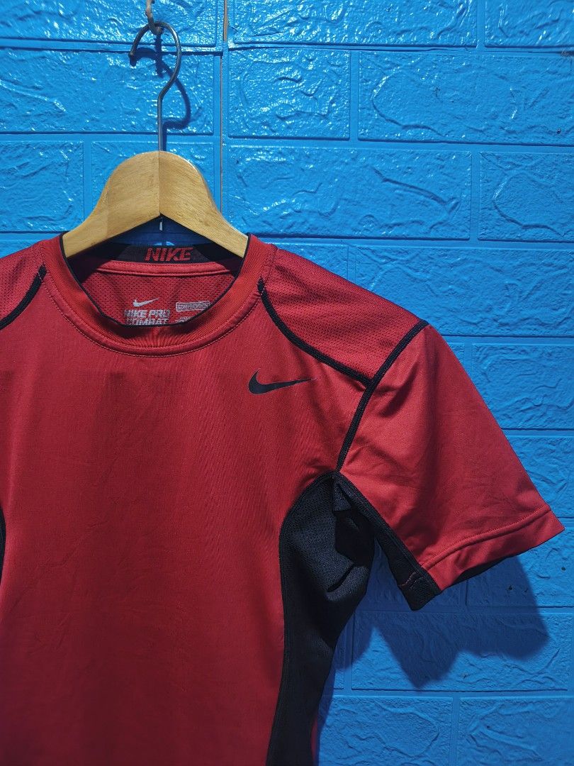 Nike Pro Combat Dri-Fit Red Compression T-Shirt Size M (Category: Activewear) located in Davao. Submitted by vndrgd (Listing ID 1452244522, Image 2). Description: - Red Nike Pro Combat Dri-Fit T-shirt - Compression Fit - Size: Medium (M) - Measurements: 16" width, 25" length - Ideal for workouts and sports.
