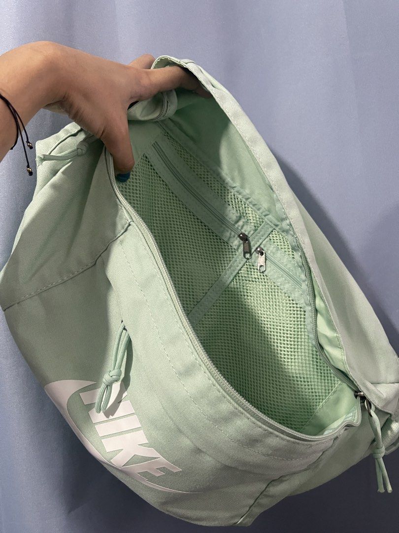 Nike Tech Hip Pack “Pistachio Frost” (Category: Belt bags, Clutches and Pouches) located in Cavite. Submitted by lengthingz (Listing ID 1452240195, Image 3). Description: - Mint green Nike fanny pack - Main compartment with internal mesh pockets and zippers - Adjustable strap with buckle closure - Ideal for carrying essentials on the go - Simple and functional design.
