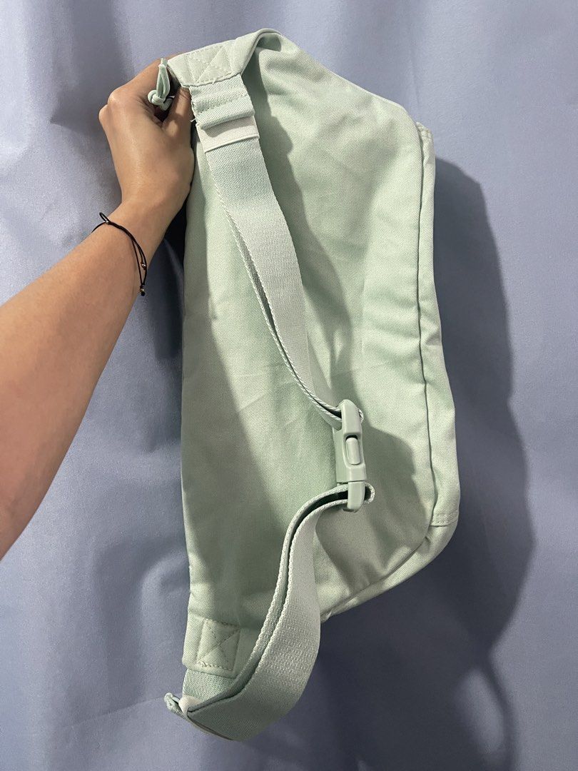 Nike Tech Hip Pack “Pistachio Frost” (Category: Belt bags, Clutches and Pouches) located in Cavite. Submitted by lengthingz (Listing ID 1452240195, Image 2). Description: - Mint green Nike fanny pack - Main compartment with internal mesh pockets and zippers - Adjustable strap with buckle closure - Ideal for carrying essentials on the go - Simple and functional design.