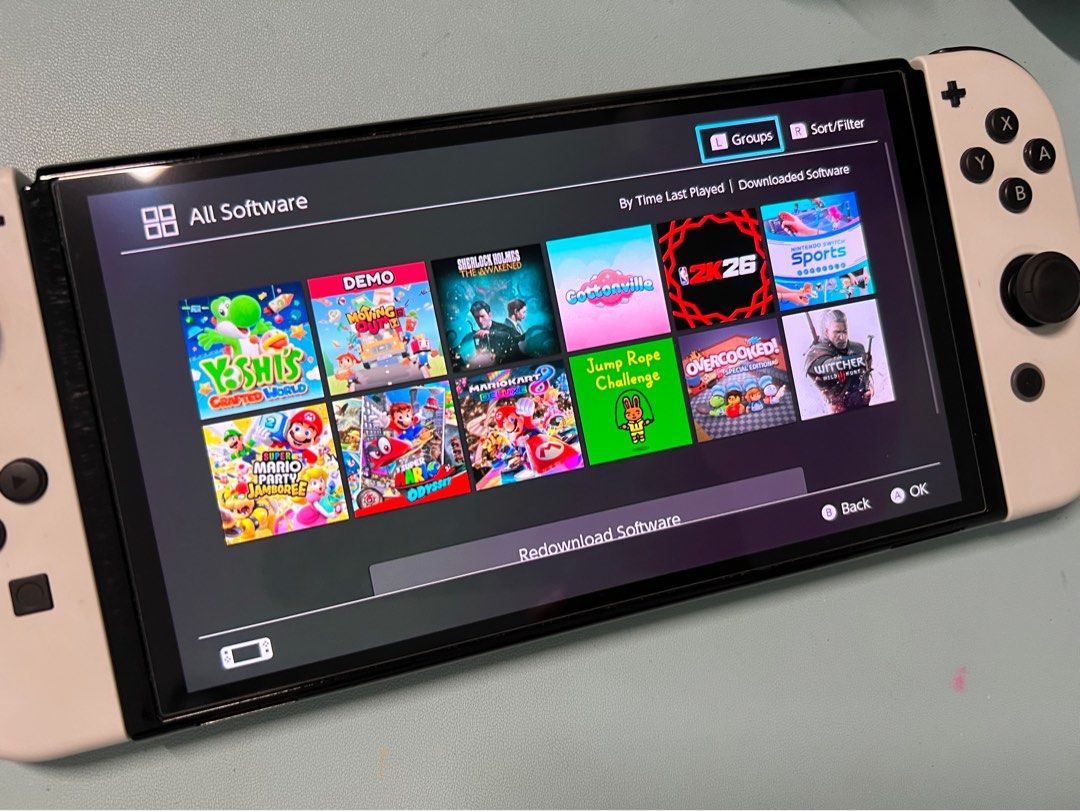 Nintendo switch oled- complete with box and accessories (Category: Nintendo) located in San Pablo. Submitted by anshinsuru (Listing ID 1452115418, Image 2). Description: For sale Nintendo switch oled with downloaded games bought in orange app, all working -Nintendo sports -NBA 26K -Yoshi's world -Mario Kart infinity -Mario Party Jamboree -Super Mario Odyssey -The witcher Bought own digital games -Overcooked -Cottonville -Sherlock Holmes The Awake