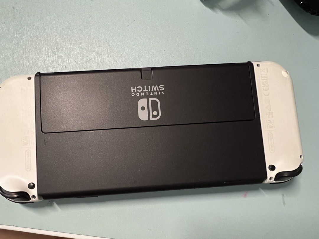 Nintendo switch oled- complete with box and accessories (Category: Nintendo) located in San Pablo. Submitted by anshinsuru (Listing ID 1452115418, Image 3). Description: For sale Nintendo switch oled with downloaded games bought in orange app, all working -Nintendo sports -NBA 26K -Yoshi's world -Mario Kart infinity -Mario Party Jamboree -Super Mario Odyssey -The witcher Bought own digital games -Overcooked -Cottonville -Sherlock Holmes The Awake