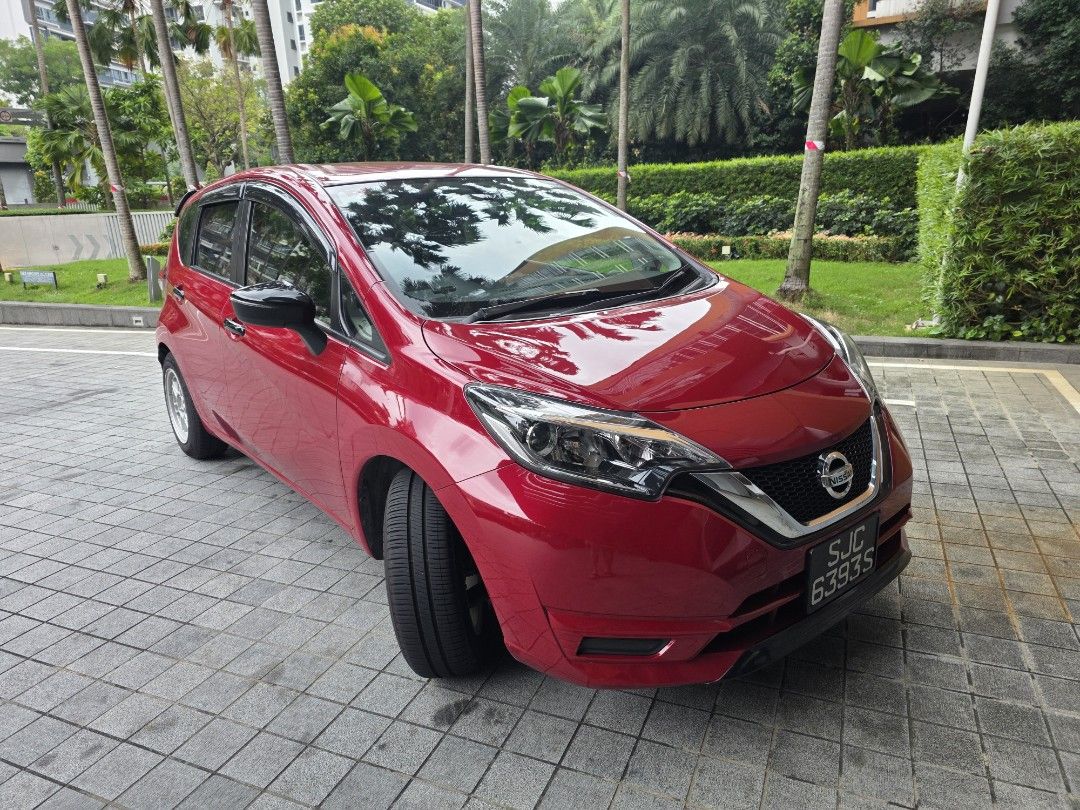 Nissan Note 1.2 YOLO Edition (A) (Category: Used Cars) located in Singapore. Submitted by pesa_s (Listing ID 1452185970, Image 1). Description: Red Nissan Note. Automatic transmission. License plate SJC 6393S. Comes with alloy rims and a spare tire kit in the trunk. Interior door panels have red accents. Plenty of space in the boot. fully sound insulated. very good condition. servicing all up to date with new tires. welcome inspection at any work