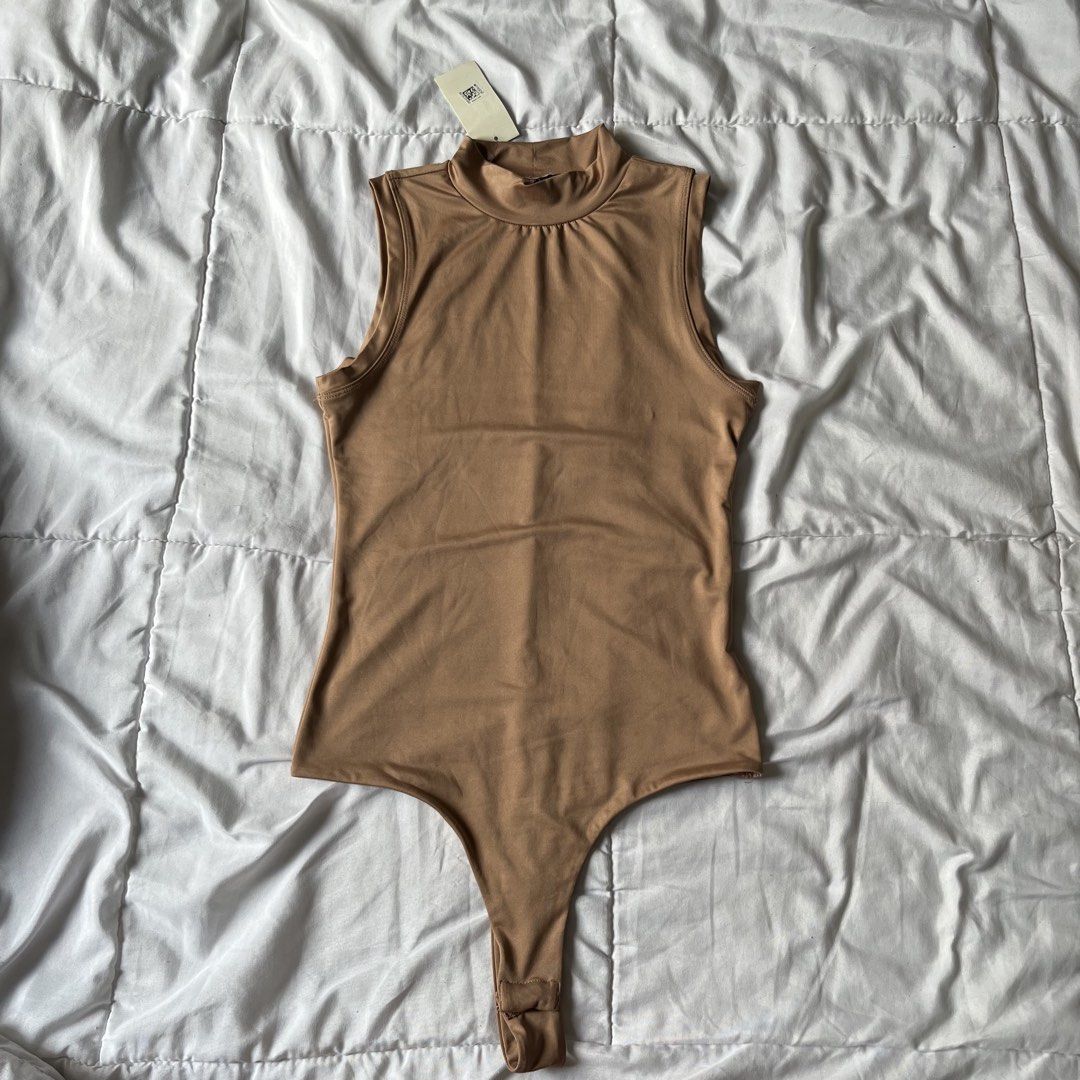 Nude High Neck Body Suit (Category: Others Tops) located in Davao. Submitted by byeooool (Listing ID 1452224938, Image 1). Description: - bought from macy's in the states - xs on tag but can fit up to small - double lined - stretchable - never been used rfs: not my style.