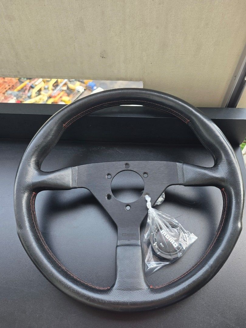 Original Momo Montecarlo (Category: Steering, Brakes, Control Parts and Accessories) located in Manila. Submitted by sound.solution (Listing ID 1452105557, Image 1). Description: original momo montecarlo red stitch with limited edition black horn.
