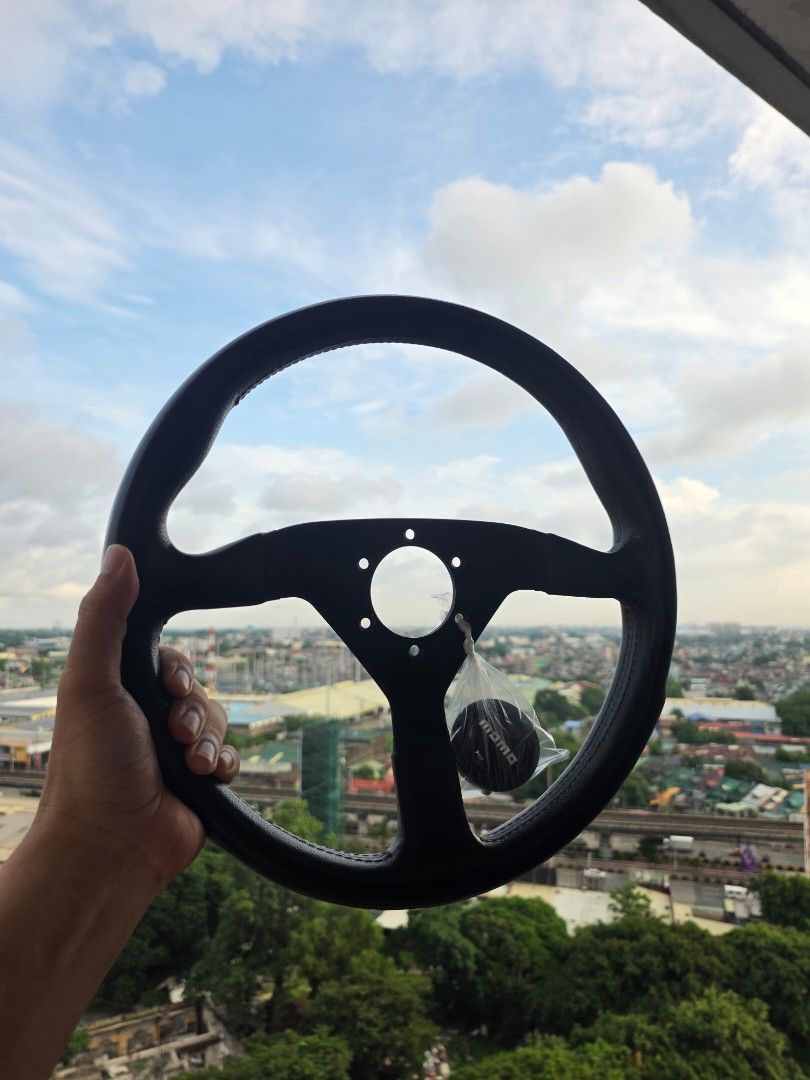 Original Momo Montecarlo (Category: Steering, Brakes, Control Parts and Accessories) located in Manila. Submitted by sound.solution (Listing ID 1452105557, Image 3). Description: original momo montecarlo red stitch with limited edition black horn.