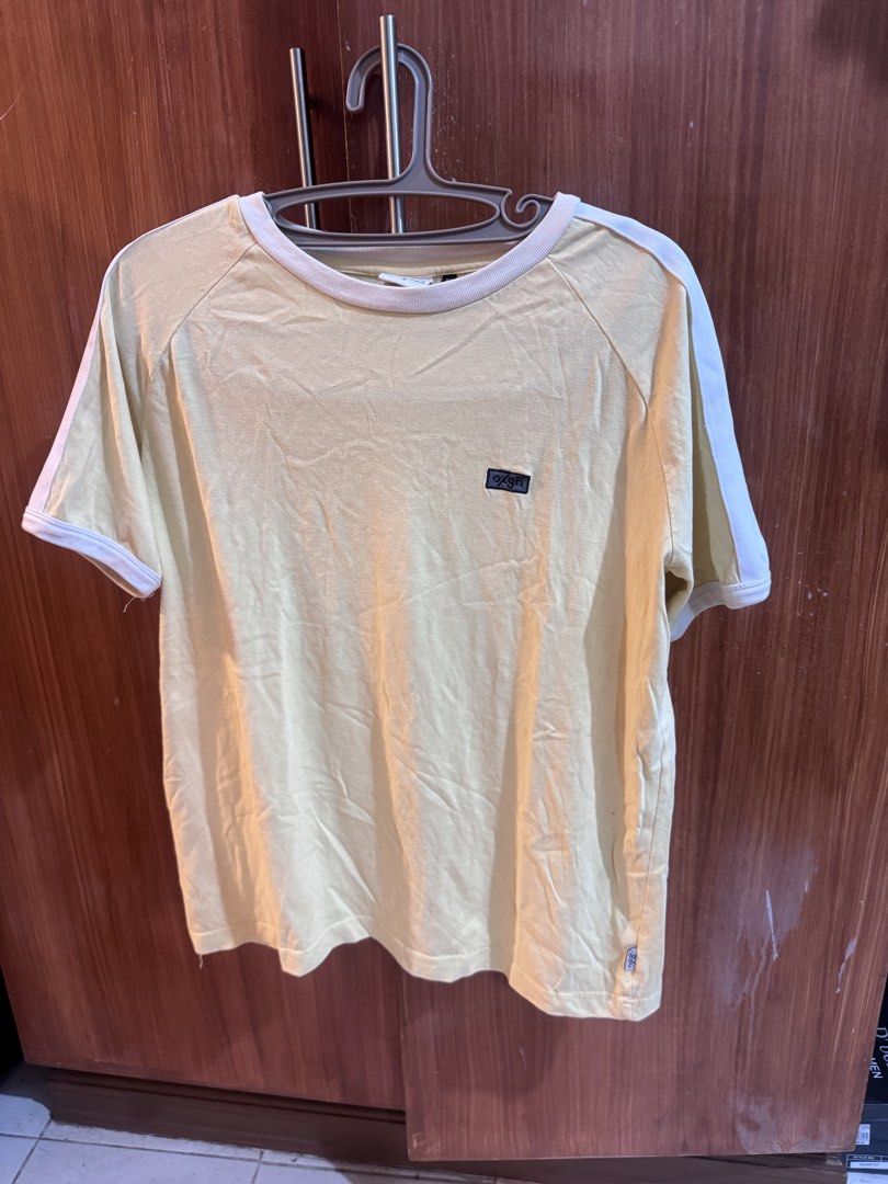 Oxgn Premium Threads Easy Fit T-shirt Size M (Category: Tshirts & Polo Shirts ) located in Manila. Submitted by ianventory (Listing ID 1452255574, Image 1). Description: - Yellow Oxgn t-shirt - Size: Medium (M) - White trim on collar and sleeves - Small Oxgn logo on chest - Additional Oxgn tag near hem - Easy fit, comfortable for casual wear.