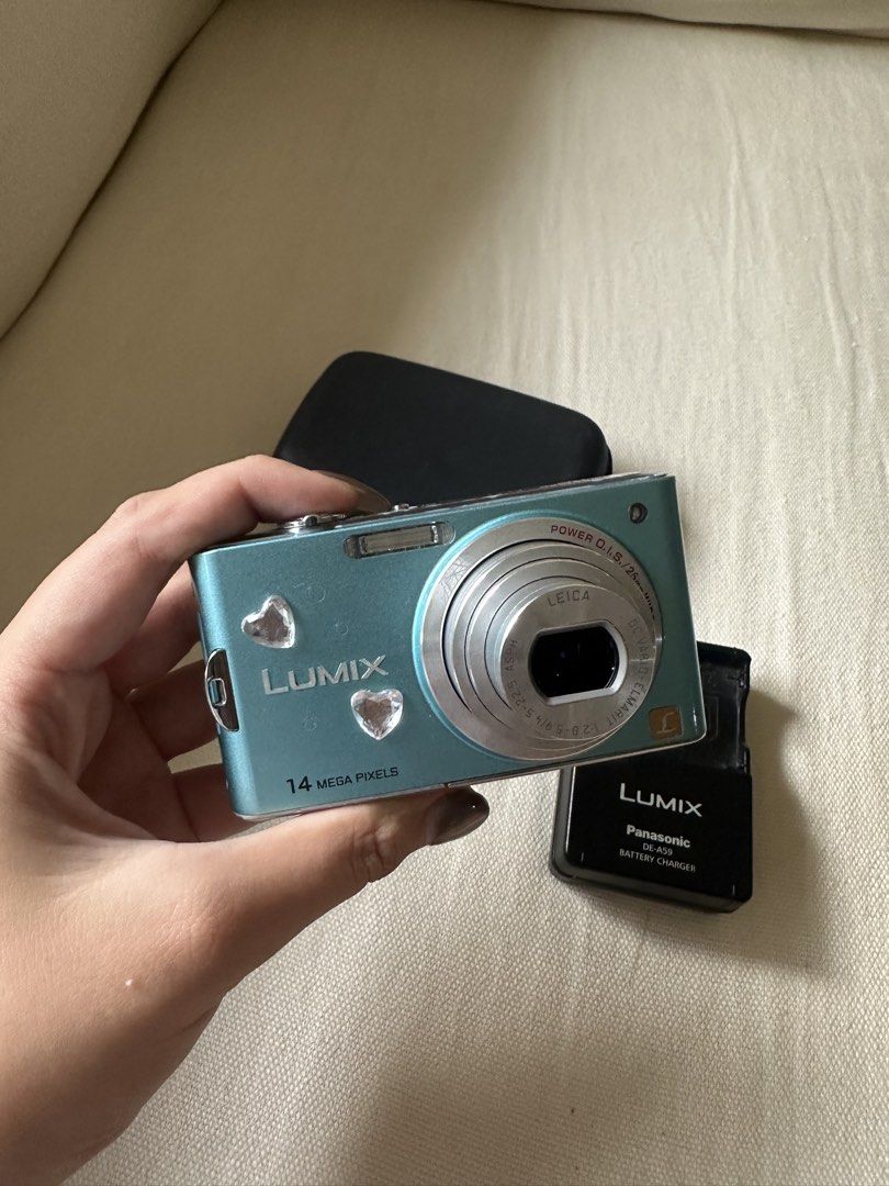 Panasonic Lumix DMC-FX66 (Category: Cameras) located in Iloilo. Submitted by denisenoelle (Listing ID 1452197359, Image 1). Description: - Teal Panasonic Lumix digital camera - 14 Megapixels - Leica lens (!!!!) - Inclusions: charger, battery & case - Screen displays in Japanese (but easy to navigate) - Tested and confirmed working - Menu with automatic camera settings - can send more test shots by request - really trusty cam, had a great time sho