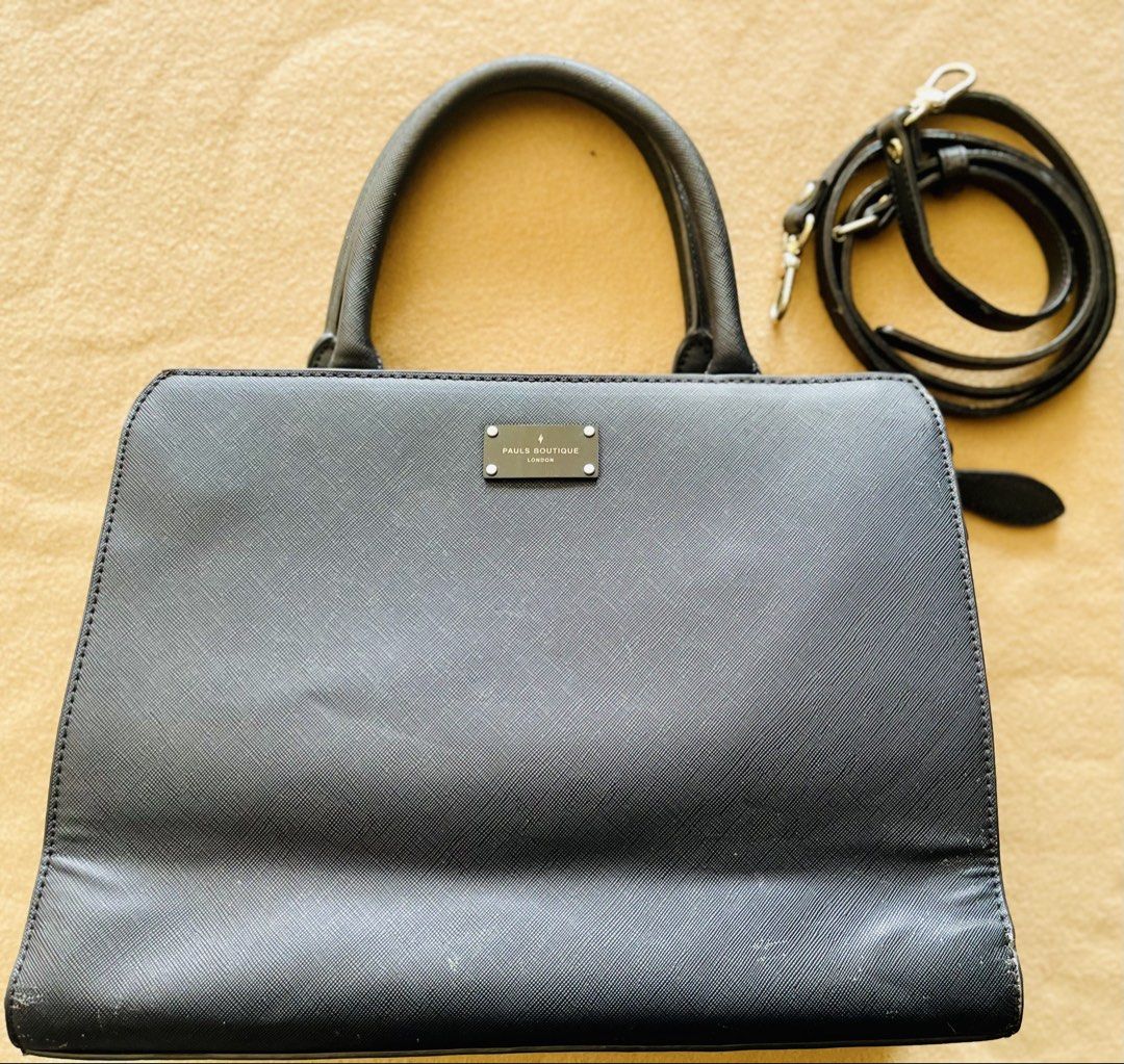 Pauls Boutique Black Office Bag (Category: Shoulder Bags) located in Imus. Submitted by cheratedfinds (Listing ID 1452312500, Image 1). Description: Authentic PAULS BOUTIQUE LONDON 2-Way Satchel / Crossbody Bag in Black Saffiano finish. - Brand: Pauls Boutique London - Color: Black - Material: 100% Polyurethane (Vegan Saffiano Leather) - Features: Signature lightning bolt interior lining, front metal logo plaque, complete with detachable long str