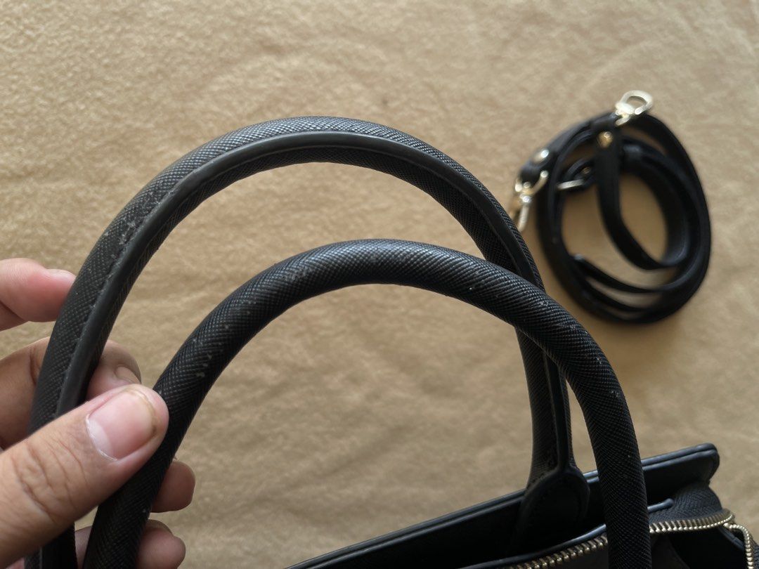 Pauls Boutique Black Office Bag (Category: Shoulder Bags) located in Imus. Submitted by cheratedfinds (Listing ID 1452312500, Image 3). Description: Authentic PAULS BOUTIQUE LONDON 2-Way Satchel / Crossbody Bag in Black Saffiano finish. - Brand: Pauls Boutique London - Color: Black - Material: 100% Polyurethane (Vegan Saffiano Leather) - Features: Signature lightning bolt interior lining, front metal logo plaque, complete with detachable long str